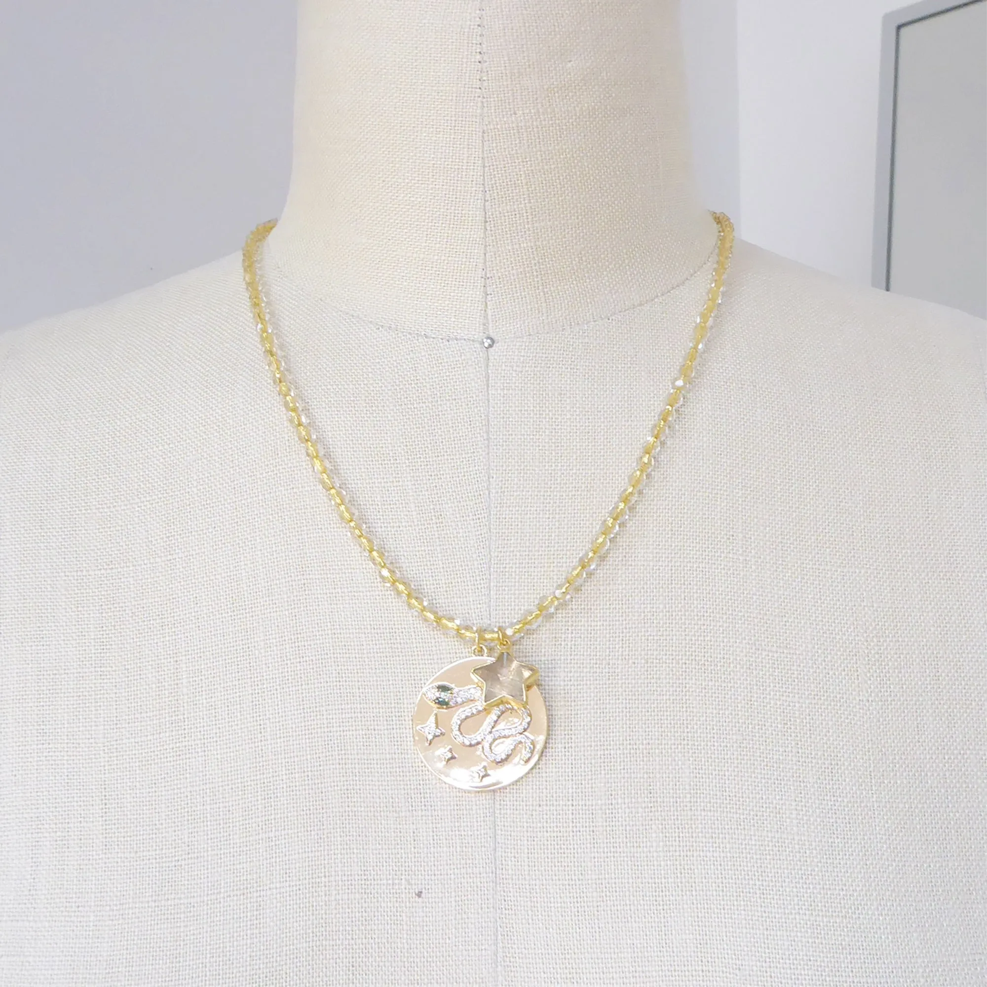 Gold snake medallion necklace