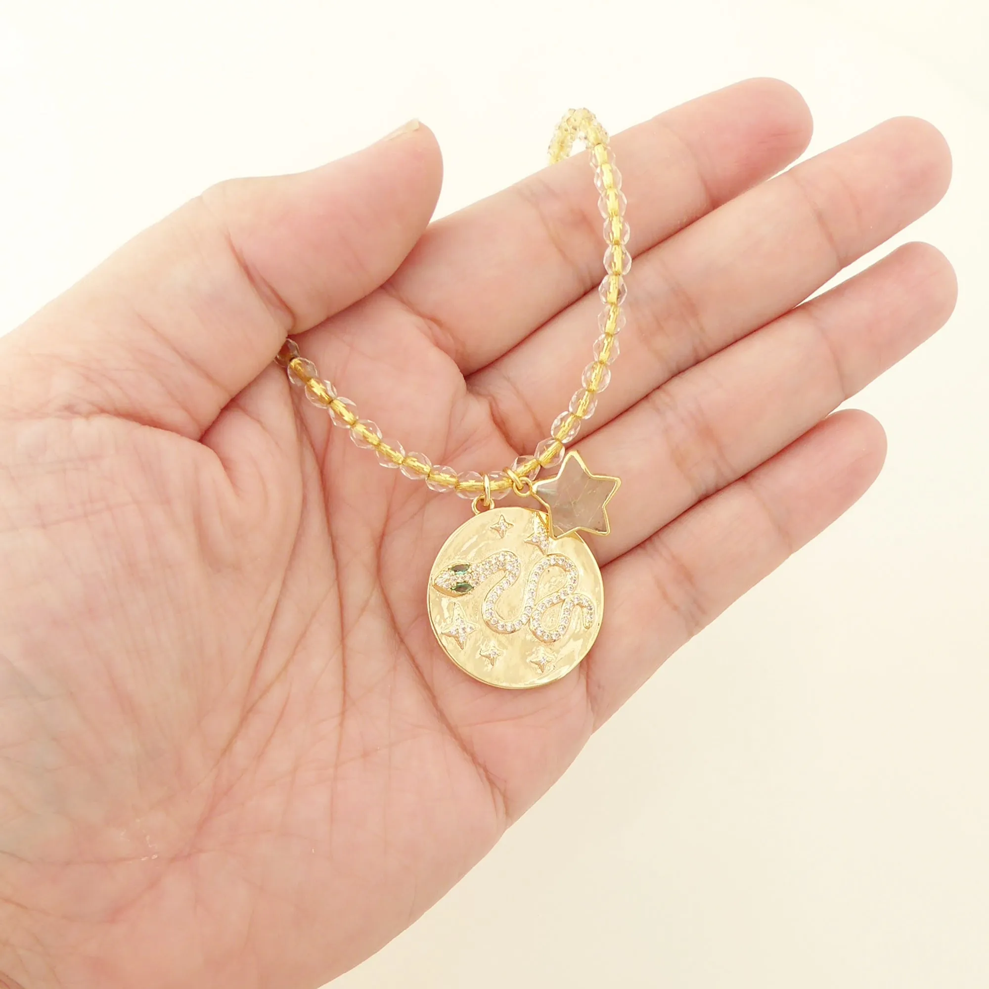 Gold snake medallion necklace