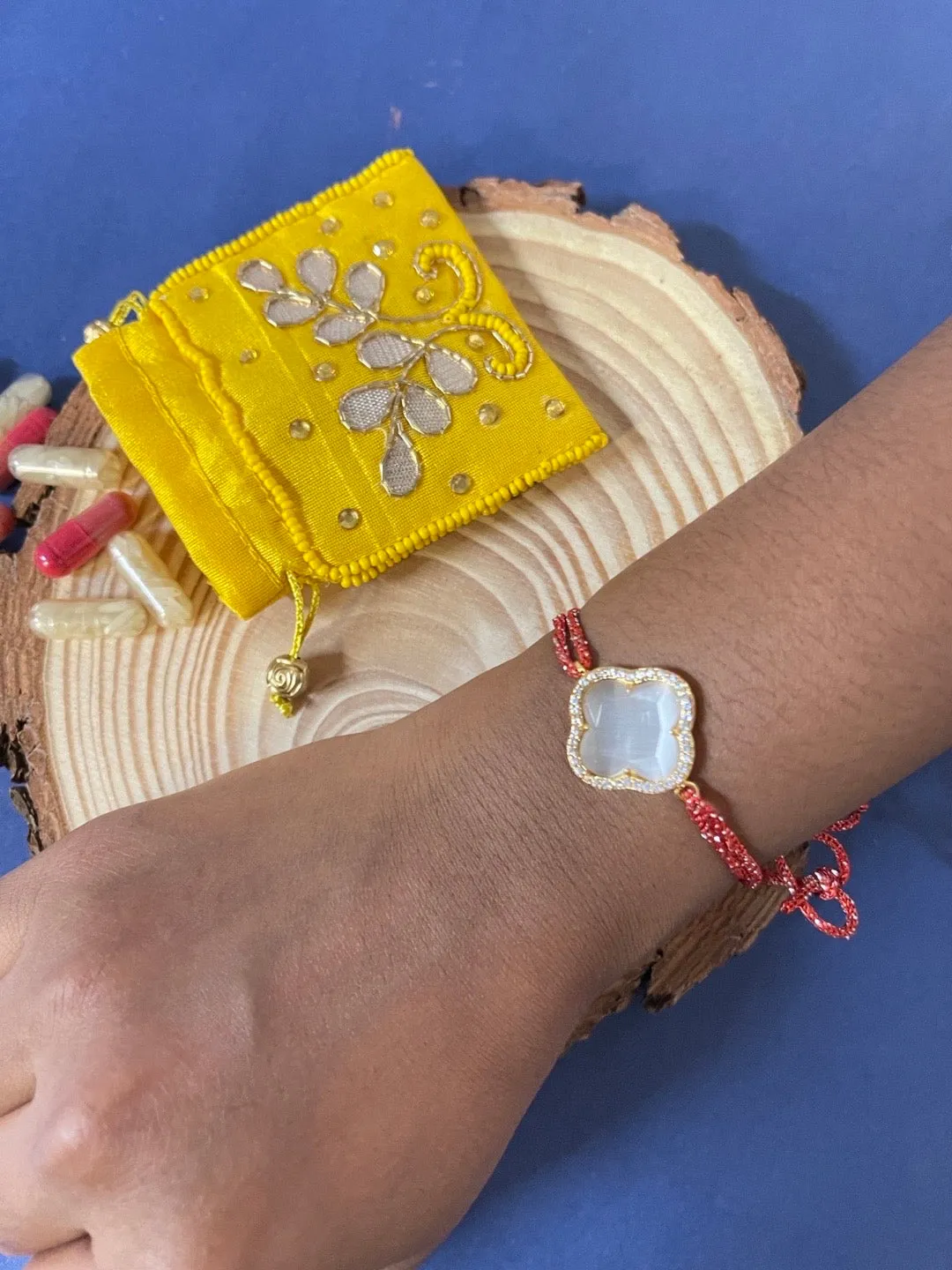 (Rakhi Set of 2) American Diamond Gold Plated Flower Bracelet & Thread Rakhi For Bhabhi-Brother